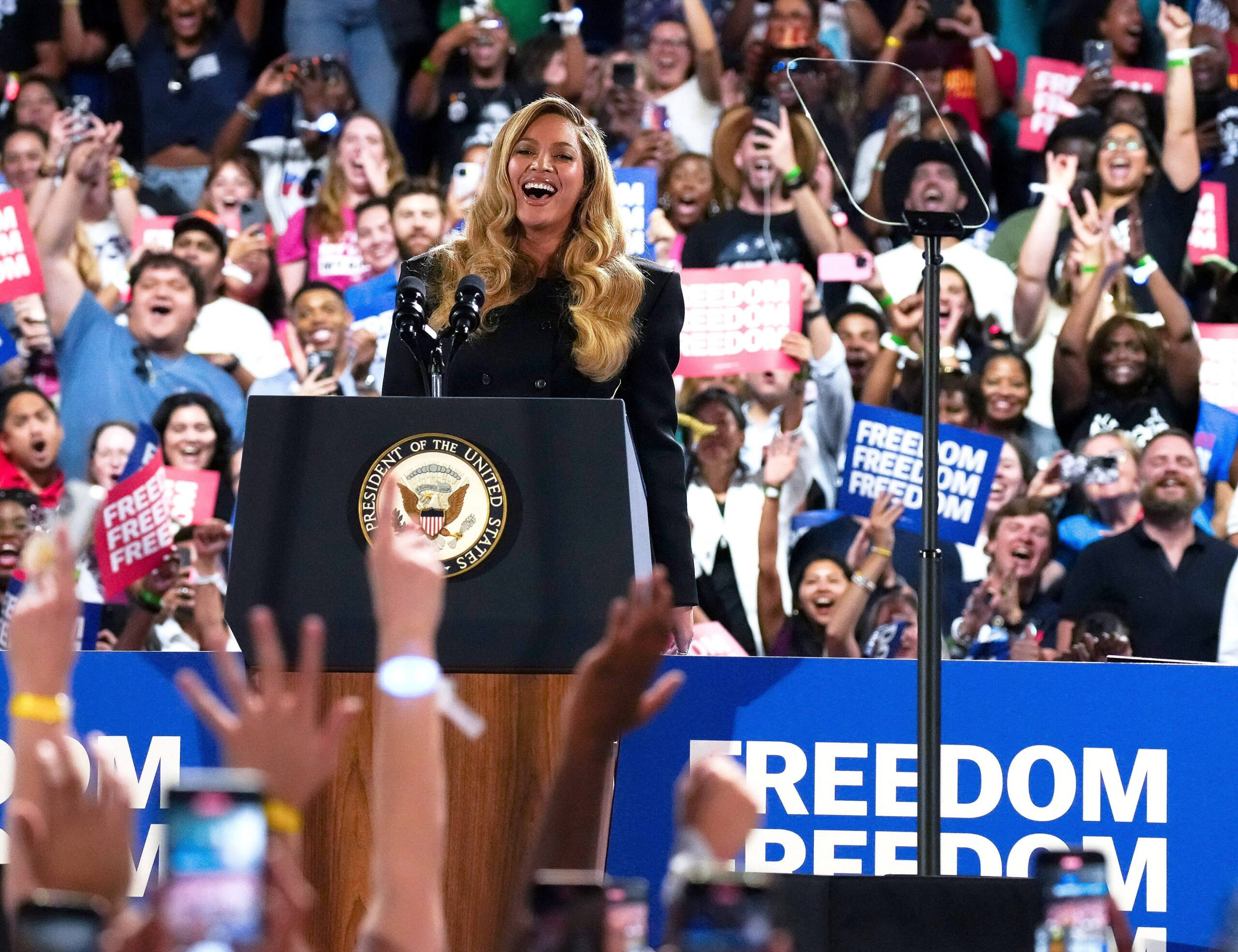 Democratic presidential nominee Vice President Kamala Harris, left, greeting musical artist Beyonce, right, on stage during a campaign event at Shell Energy Stadium on Friday October25, 2024 in Houston, Texas.